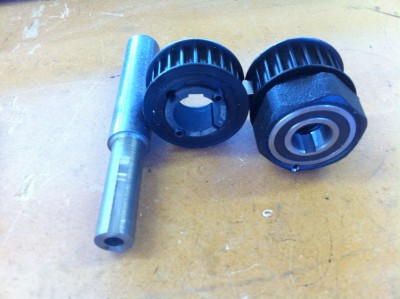 The left pulley is a standard taper lock fitting the right one is modified with a one way drive sprag bearing
