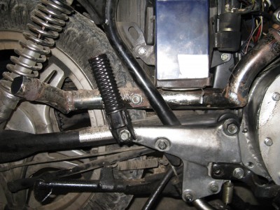 The tailpipe I build from the original Honda double wall chrome pipe, cut at angles and rewelded to get the right "curve." Leaky and restrictive for sure.  To be replaced eventually.