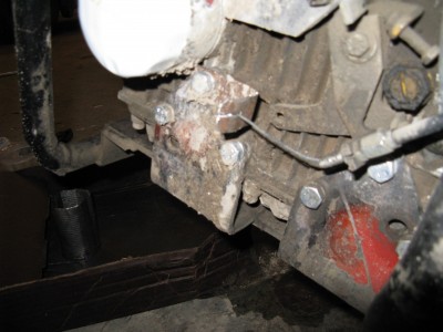 My throttle cable assembly.  Pardon all the mud.  It was much easier to have the cable sheath push the throttle lever.  We will see how this works out long term.