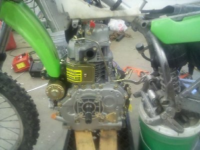 Motor forward... less wheel travel and I'd need to trim the fender.